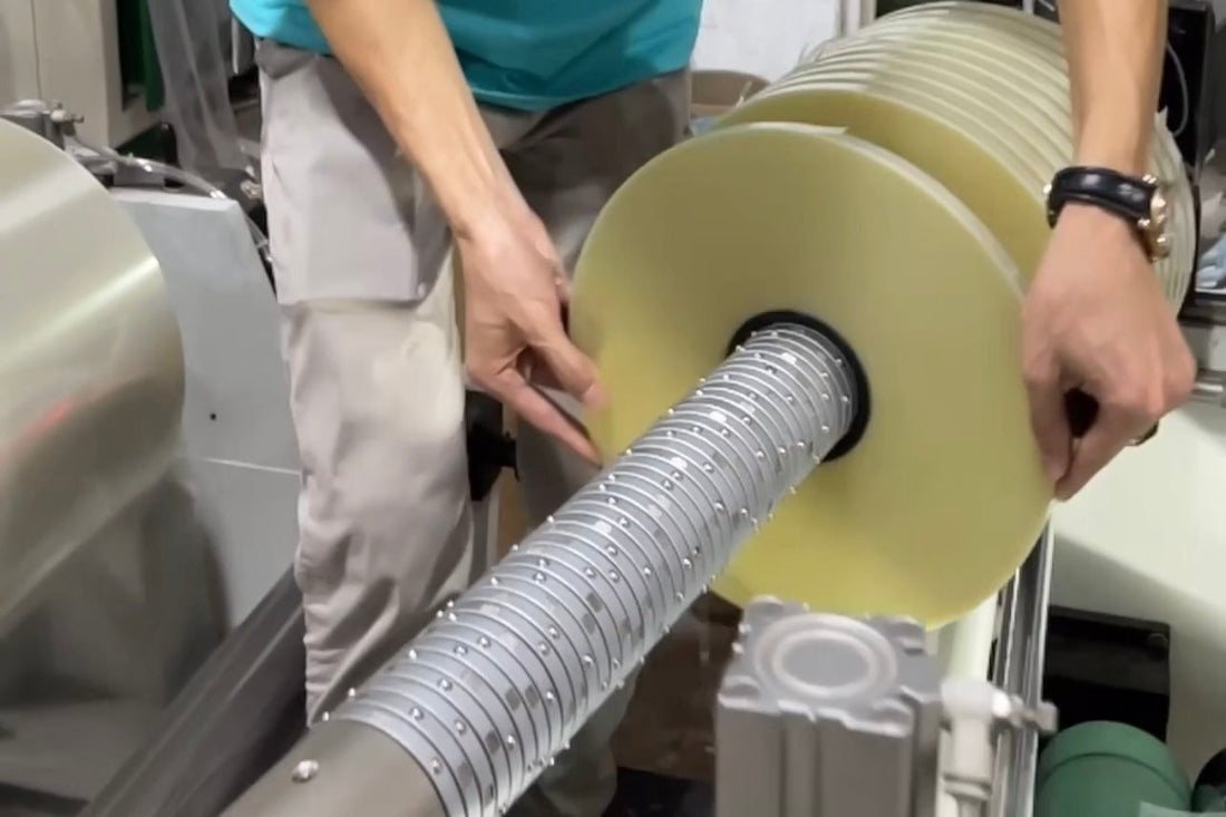 XW Machiniery Differential Shaft installed on a slitting and rewinding machine for precise multi-roll tension control and uniform winding quality.