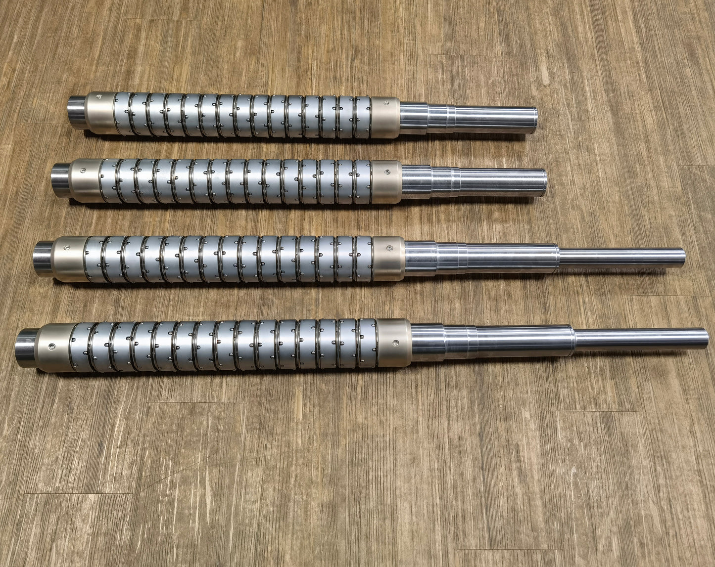 Pneumatic ball slip core shaft system for multi-roll tension balancing applications