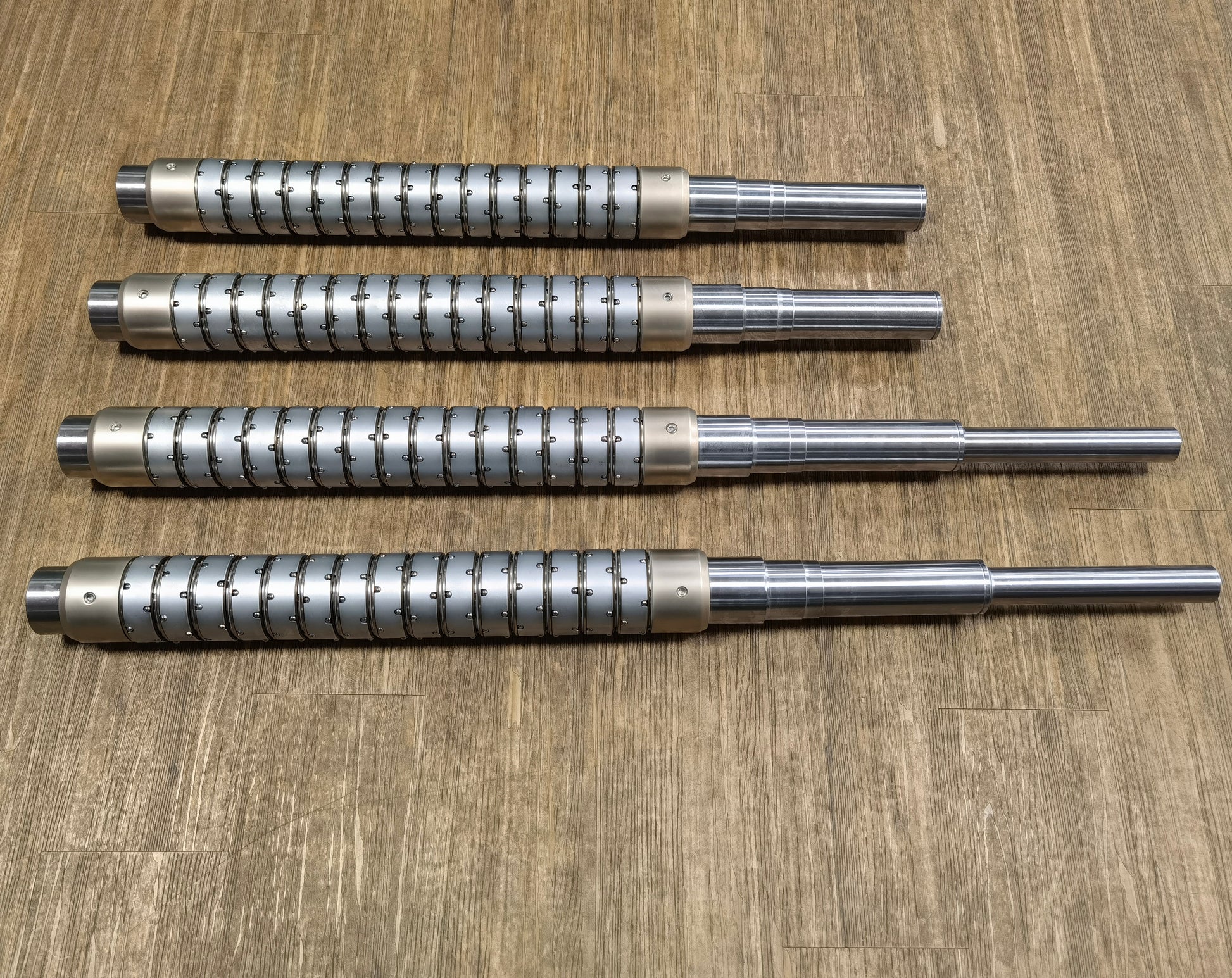 Pneumatic ball slip core shaft system for multi-roll tension balancing applications