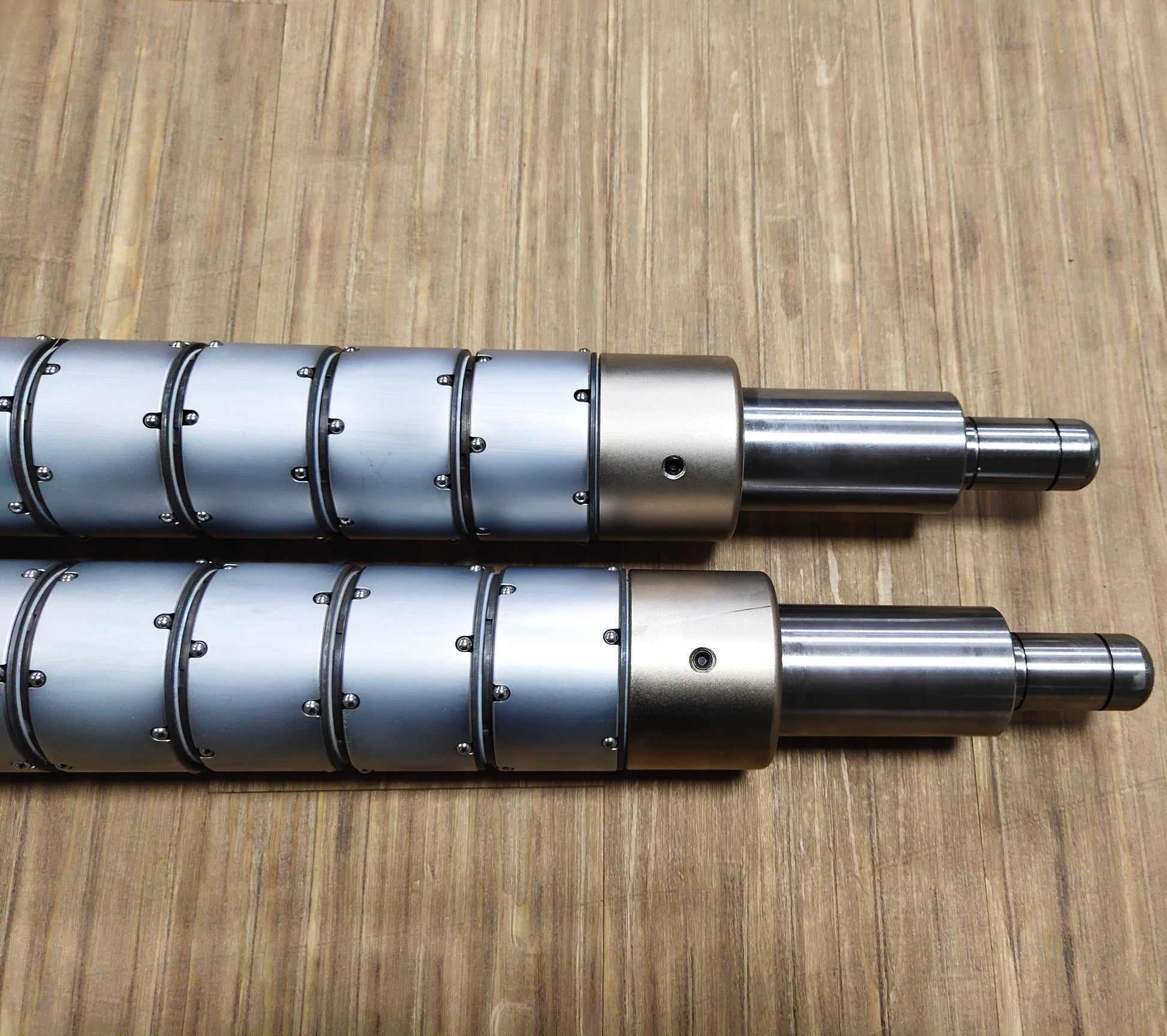 Precision ball locking slip shaft for roll winding equipment with consistent tension performance