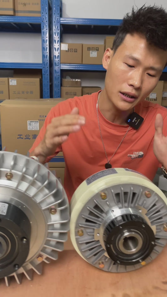 Through bore magnetic particle clutch used in slitting and rewinding machines